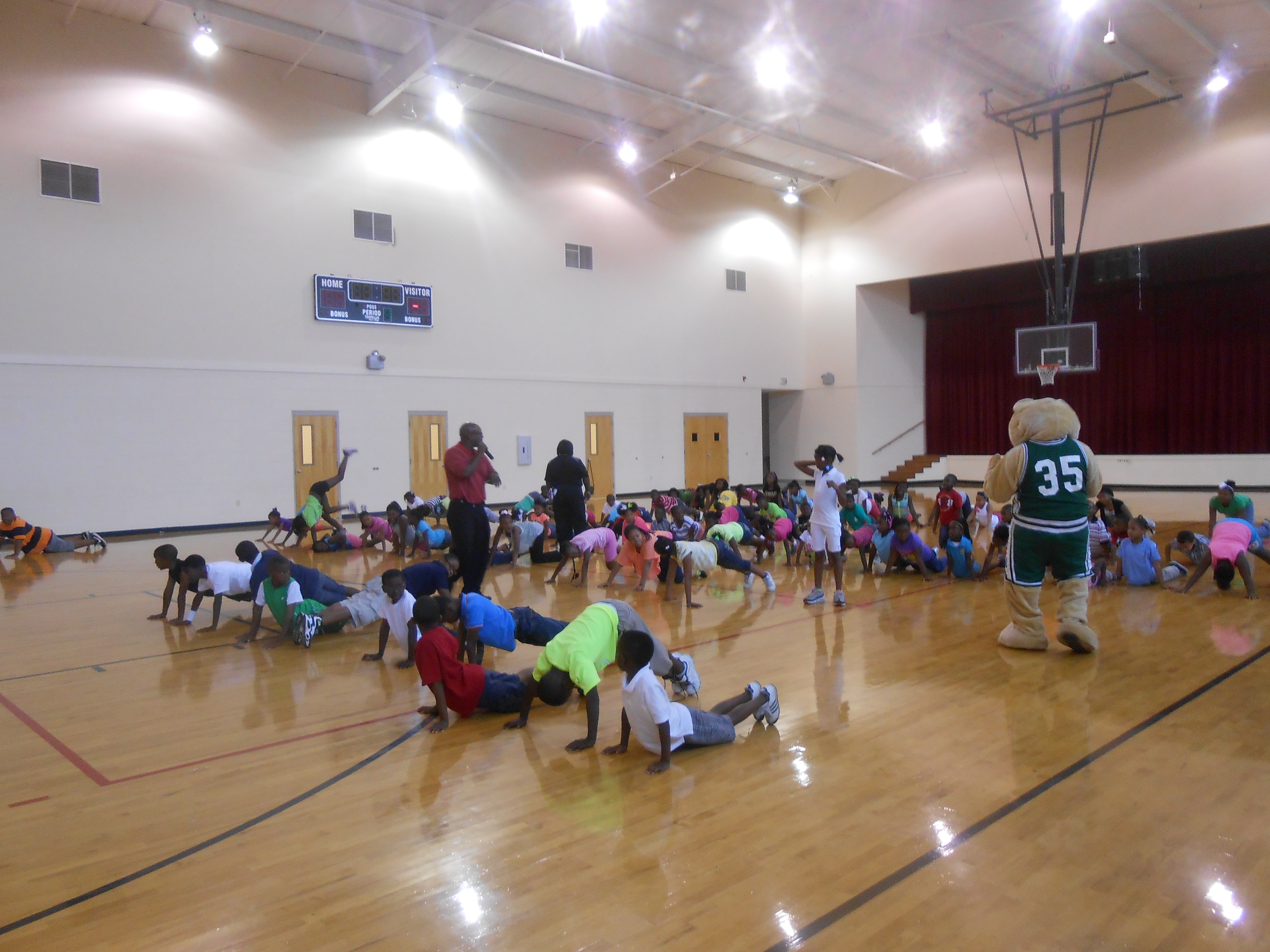 Photo:  Students performing exercises to help reduce the causes of obesity and asthma. 